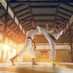 Image of two martial art karate fighters practicing a fighting martial arts style